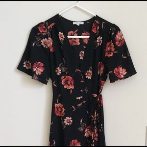 Long, black flowered wrap dress by Cotton Candy LA